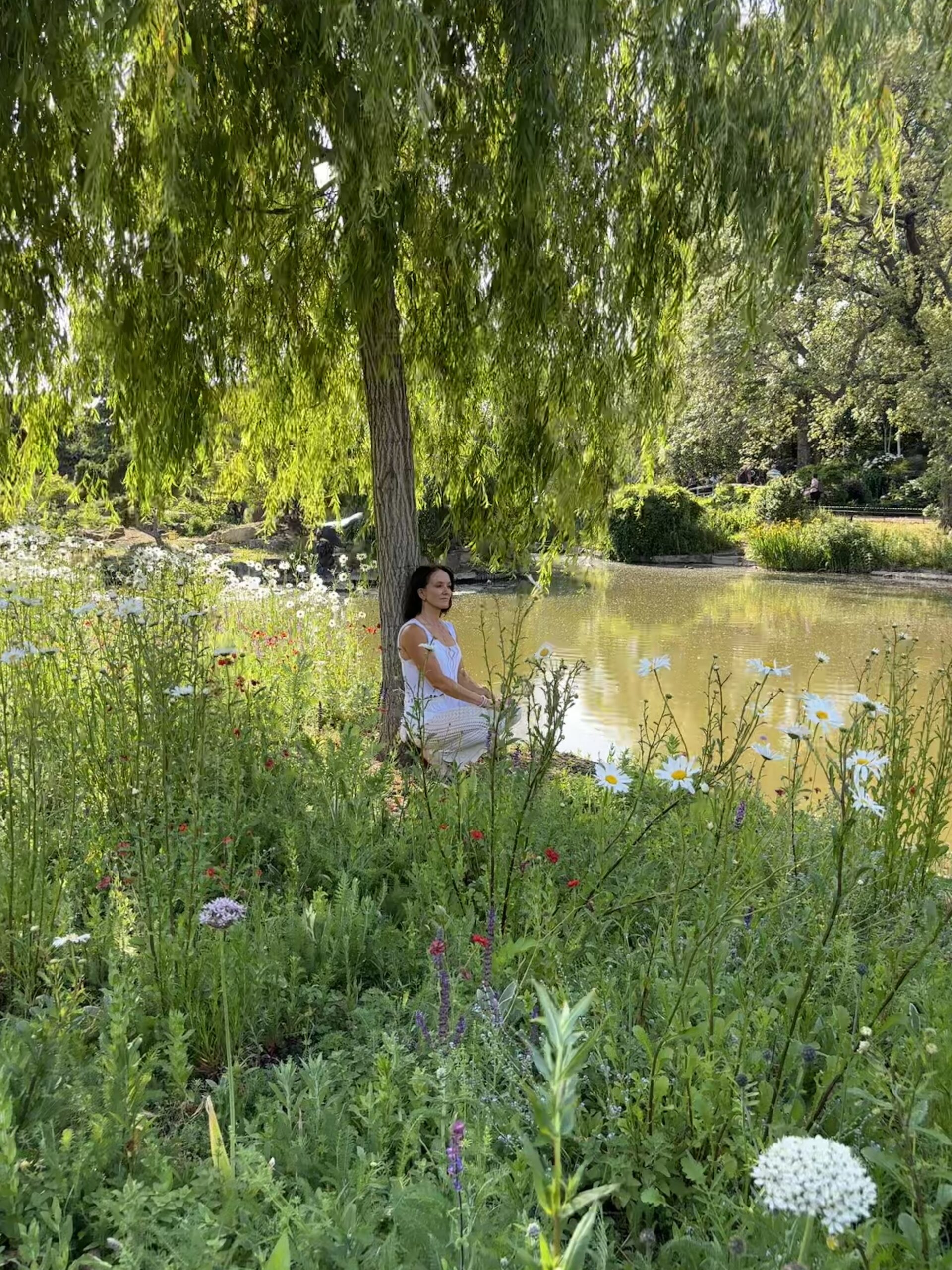 Full length portrait of Michelle by an ancient tree, radiating strength and resilience.