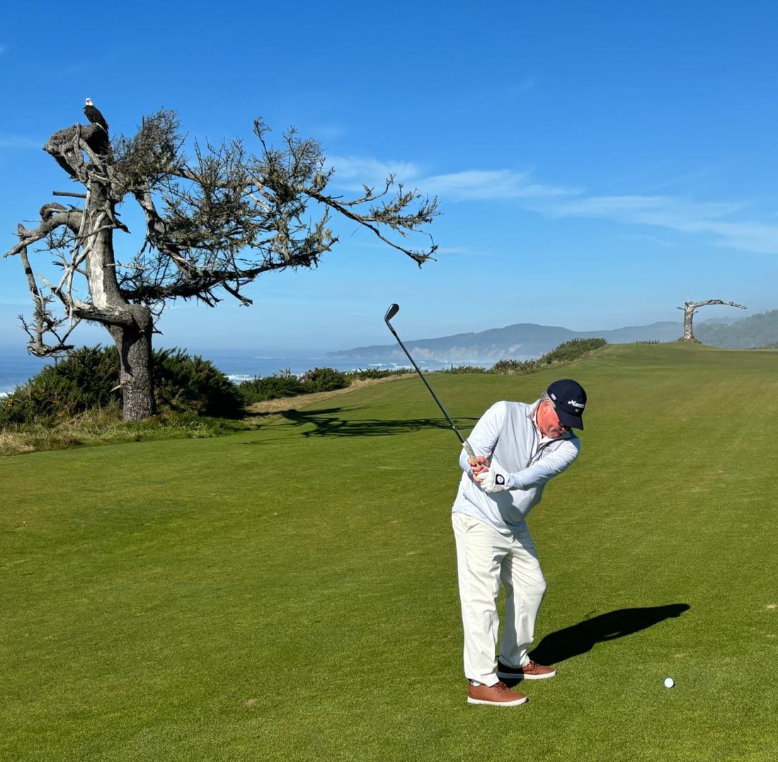 Mark golfing at Bandon Dunes overlooking the Pacific and being watched by a rare eagle